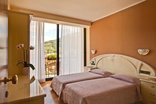 Imagen de la habitación del Hotel Garda - TonelliHotels. Foto 8