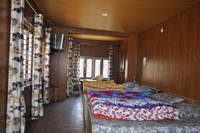 Imagen de la habitación del Hotel Garden Cottage and Restaurant. Foto 10