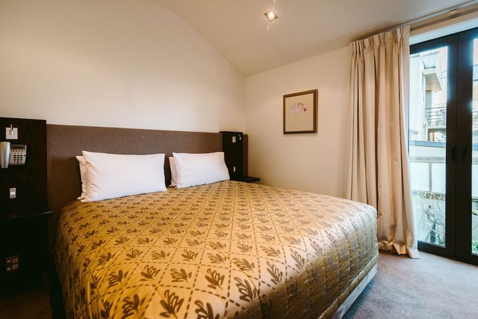 Imagen de la habitación del Hotel Garden Court Suites And Apartments. Foto 9