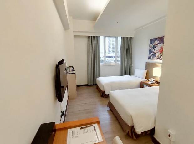 Imagen de la habitación del Hotel Garden Education Culture Hotel. Foto 21