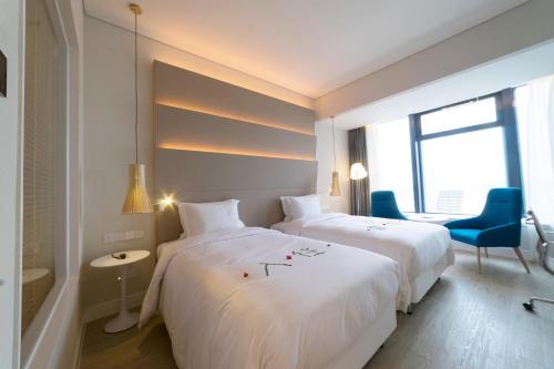 Imagen de la habitación del Hotel Garden Lane Meilan Airport Hotel. Foto 5
