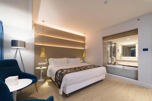 Imagen de la habitación del Hotel Garden Lane Meilan Airport Hotel. Foto 8