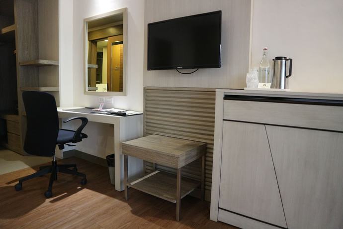 Imagen de la habitación del Hotel Garden Orchid Hotel. Foto 17