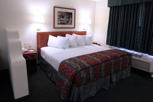 Imagen de la habitación del Hotel Garden Place Suites. Foto 7