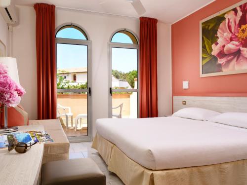 Imagen de la habitación del Hotel Garden Toscana Resort. Foto 9