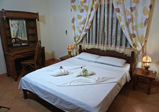Imagen de la habitación del Hotel Garden of Eden Dive Resort. Foto 18
