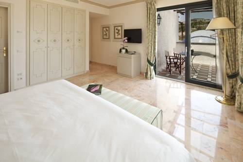 Imagen de la habitación del Hotel Garden y Villas Resort. Foto 7