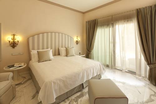 Imagen de la habitación del Hotel Garden y Villas Resort. Foto 10