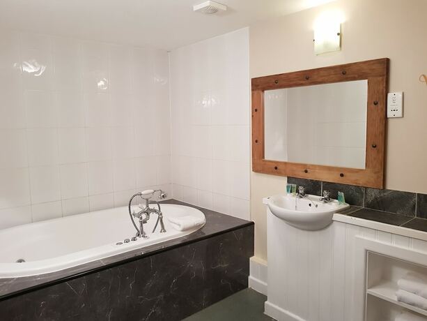 Imagen de la habitación del Hotel Gardeners Country Inn. Foto 20