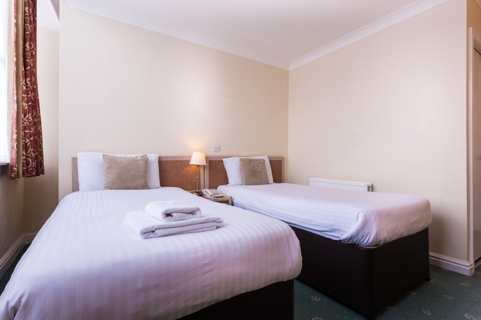 Imagen de la habitación del Hotel Gardens. Foto 10