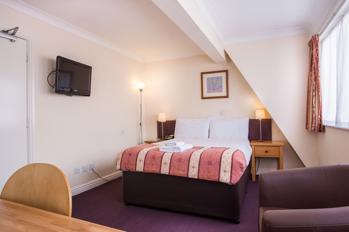 Imagen de la habitación del Hotel Gardens. Foto 11