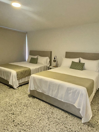 Imagen de la habitación del Hotel Gardin home. Foto 8