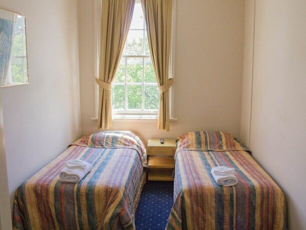 Imagen de la habitación del Hotel Gardners Inn. Foto 19