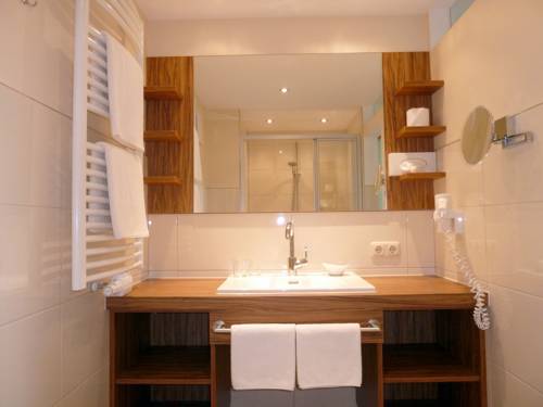 Imagen de la habitación del Hotel Garni Grünmoos. Foto 15