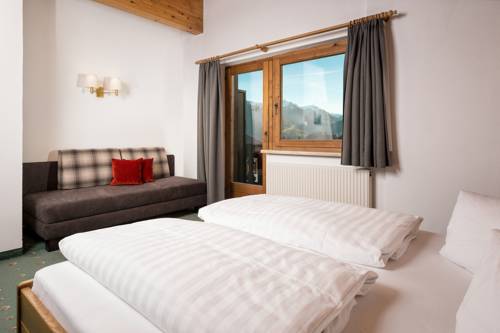 Imagen de la habitación del Hotel Garni Hubertushof. Foto 16