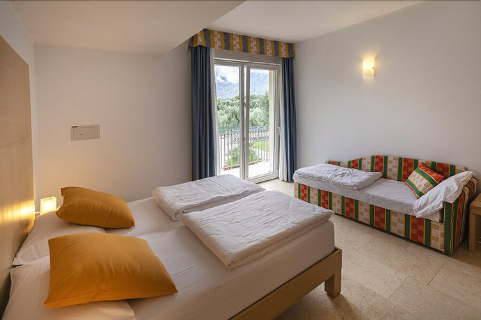 Imagen de la habitación del Hotel Garni Orchidea. Foto 17