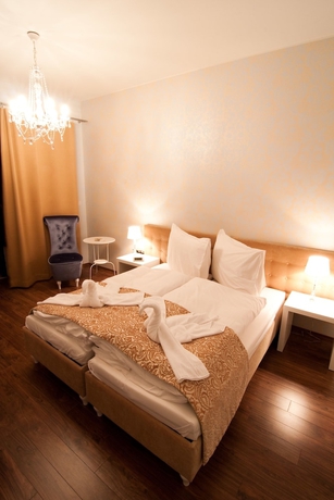 Imagen de la habitación del Hotel Garni Virgo. Foto 11