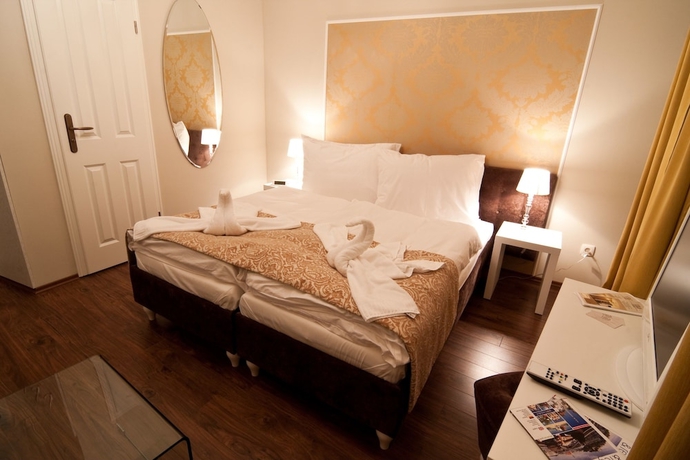 Imagen de la habitación del Hotel Garni Virgo. Foto 13