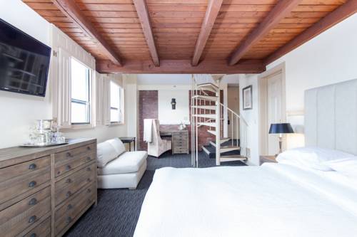 Imagen de la habitación del Hotel Garrison Inn Boutique. Foto 7