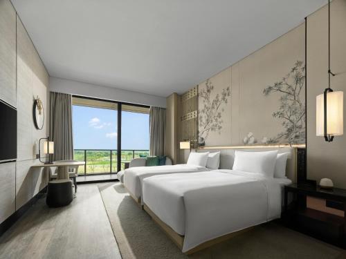 Imagen de la habitación del Hotel Garrya Yangcheng Lake. Foto 14