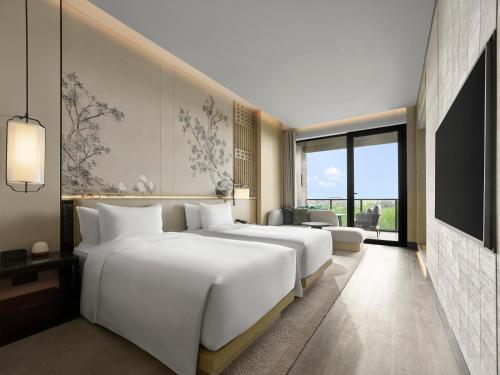Imagen de la habitación del Hotel Garrya Yangcheng Lake. Foto 15