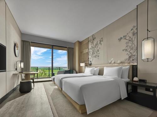 Imagen de la habitación del Hotel Garrya Yangcheng Lake. Foto 16