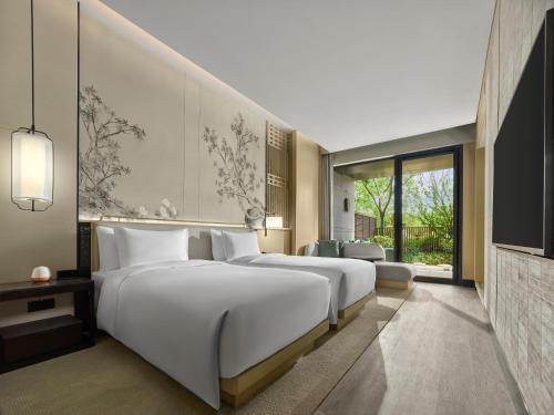 Imagen de la habitación del Hotel Garrya Yangcheng Lake. Foto 17