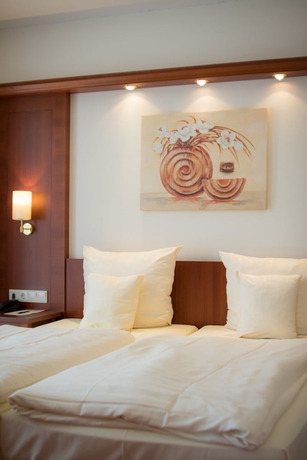 Imagen de la habitación del Hotel Gartenhotel Heusser. Foto 16