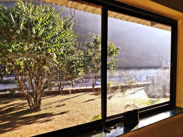 Imagen de la habitación del Hotel Garud Chatti River Resort. Foto 13