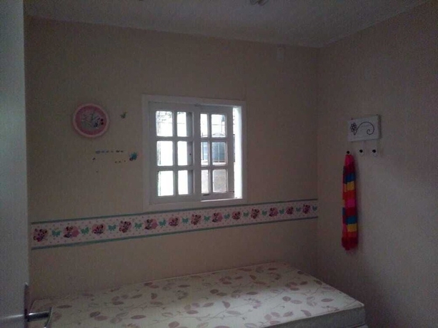 Imagen de la habitación del Hotel Gato de Botas Flats and Suites. Foto 8