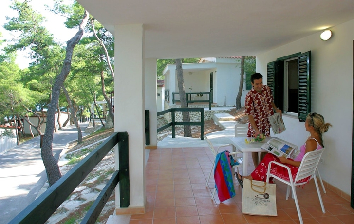 Imagen de la habitación del Hotel Gattarella Family Resort - Self-catering Accommodations In The Pinewood. Foto 3