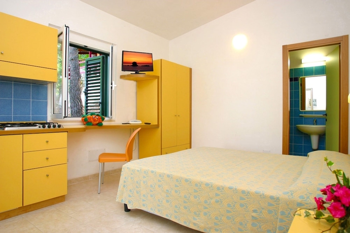 Imagen de la habitación del Hotel Gattarella Family Resort - Self-catering Accommodations In The Pinewood. Foto 4