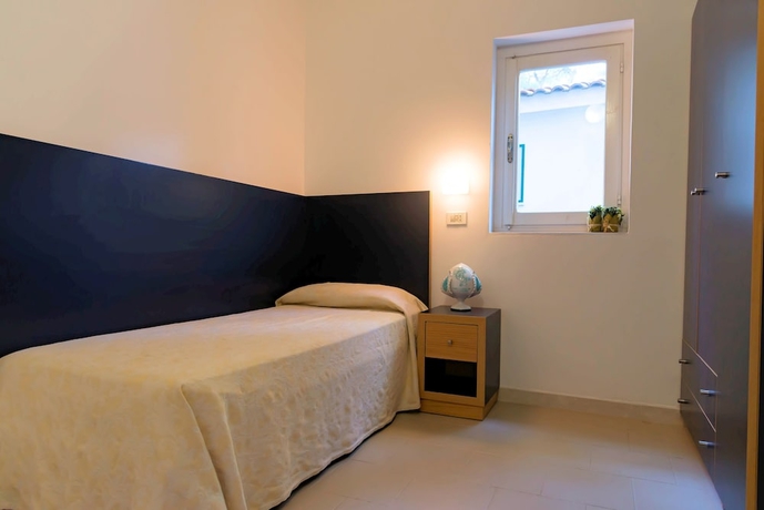 Imagen de la habitación del Hotel Gattarella Family Resort - Self-catering Accommodations In The Pinewood. Foto 7