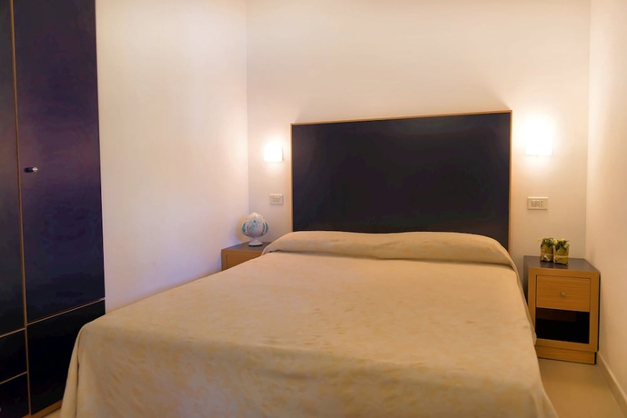 Imagen de la habitación del Hotel Gattarella Family Resort - Self-catering Accommodations In The Pinewood. Foto 8