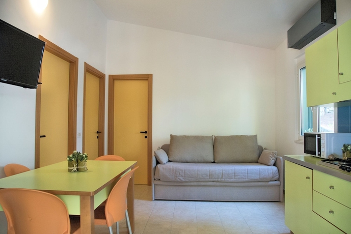 Imagen de la habitación del Hotel Gattarella Family Resort - Self-catering Accommodations In The Pinewood. Foto 9