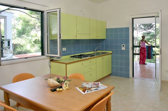 Imagen de la habitación del Hotel Gattarella Family Resort - Self-catering Accommodations In The Pinewood. Foto 10