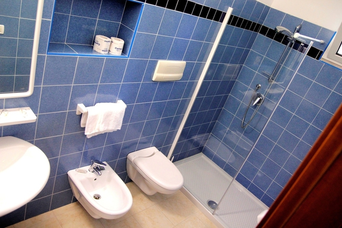 Imagen de la habitación del Hotel Gattarella Family Resort - Self-catering Accommodations In The Pinewood. Foto 12