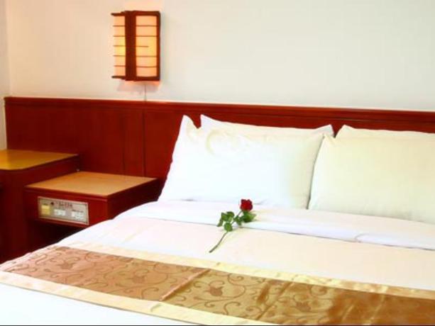 Imagen de la habitación del Hotel Gau Shan Ching Hotel. Foto 5