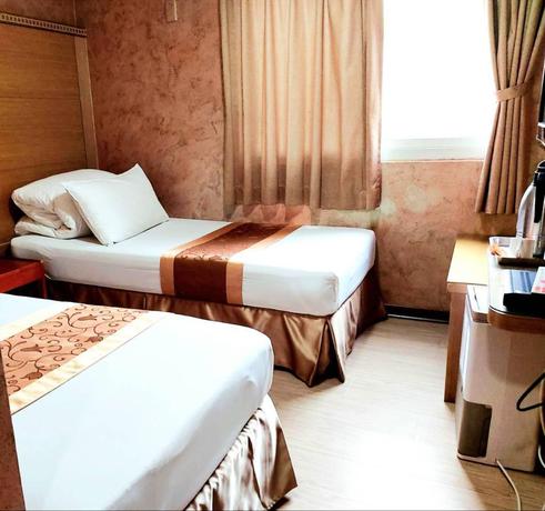Imagen de la habitación del Hotel Gau Shan Ching Hotel. Foto 6