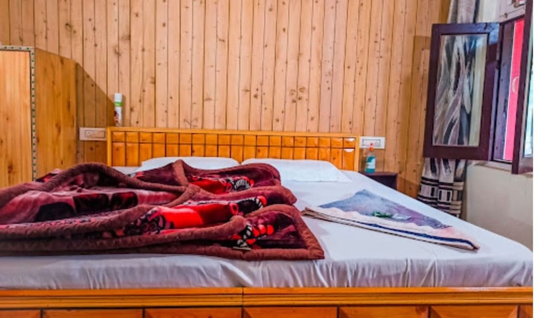 Imagen de la habitación del Hotel Gautam Khajjiar. Foto 9