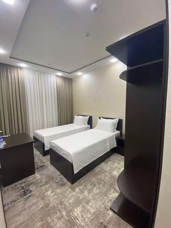 Imagen de la habitación del Hotel G'ayrat Hoji Ota. Foto 9