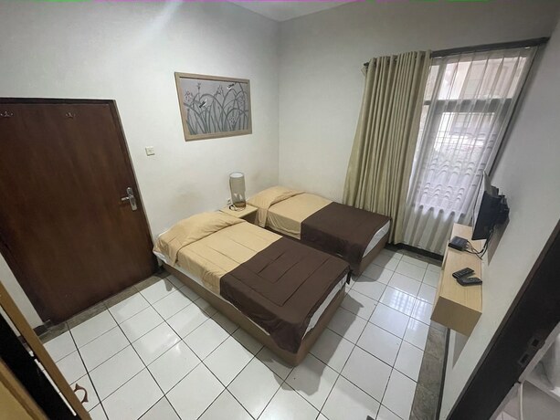 Imagen de la habitación del Hotel Gegerkalong Asri. Foto 15