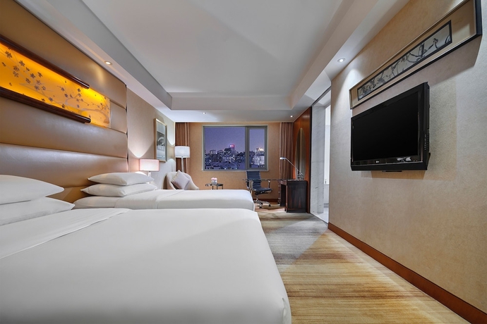 Imagen de la habitación del Hotel Gehua New Century. Foto 10