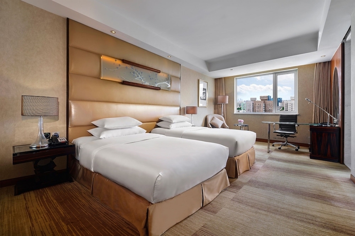 Imagen de la habitación del Hotel Gehua New Century. Foto 11