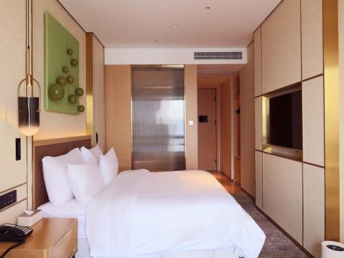 Imagen de la habitación del Hotel Geli Bengbu Wanda Plaza Nanxiang City. Foto 17
