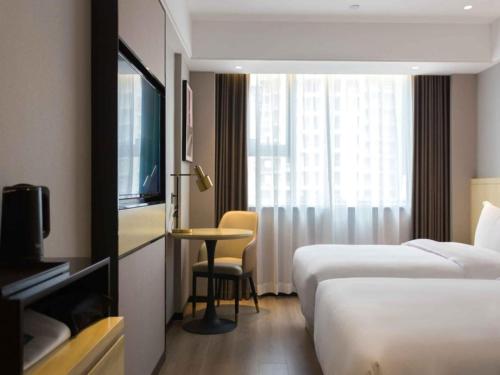 Imagen de la habitación del Hotel Geli Zaozhuang High-Speed Railway Station. Foto 10