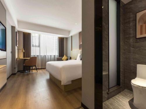 Imagen de la habitación del Hotel Geli Zaozhuang High-Speed Railway Station. Foto 13