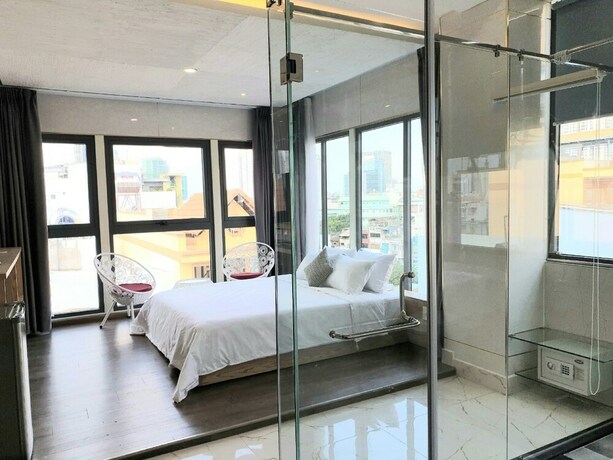 Imagen de la habitación del Hotel Gemini Saigon Hotel. Foto 19