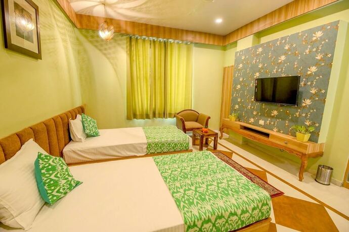 Imagen de la habitación del Hotel Gems Suites. Foto 17