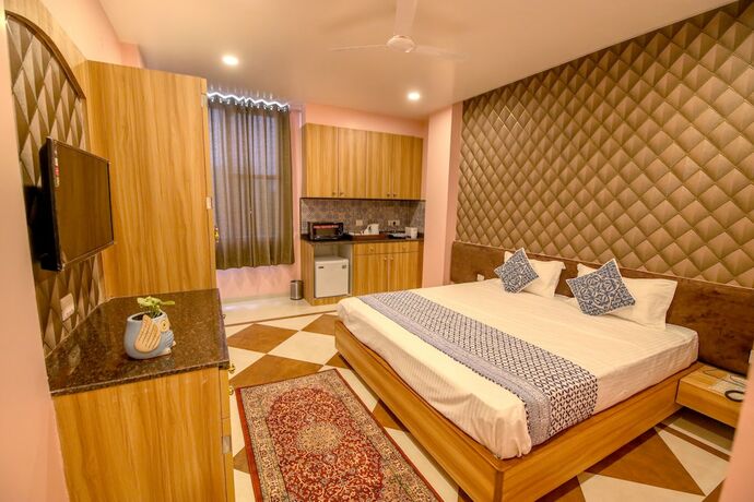 Imagen de la habitación del Hotel Gems Suites. Foto 18